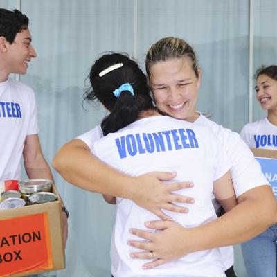 Two volunteers hugging