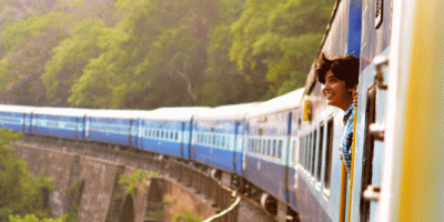 woman looking out of a train window