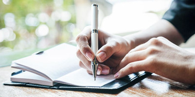 hand writing in a journal