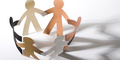 paper dolls holding hands in a circle