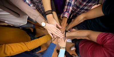 several hands in the middle