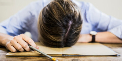 Head laying on Table