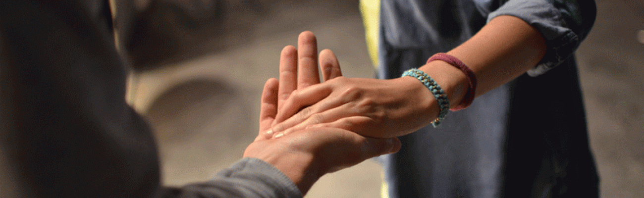 a couples hands clasped