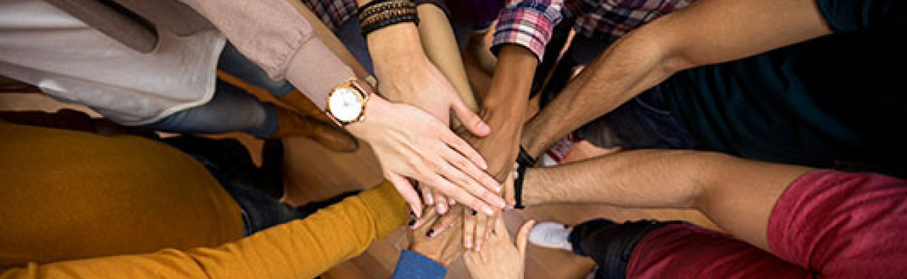 several hands in the middle