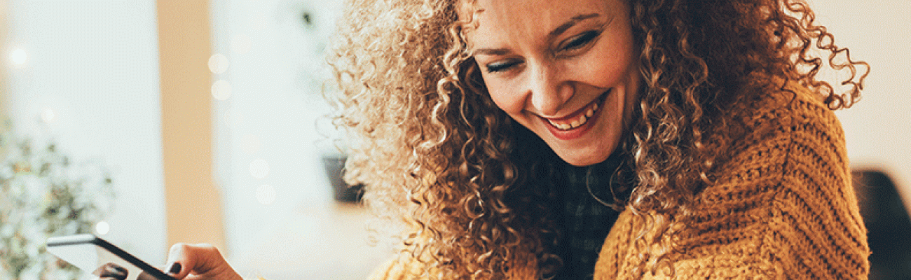 woman laughing to herself