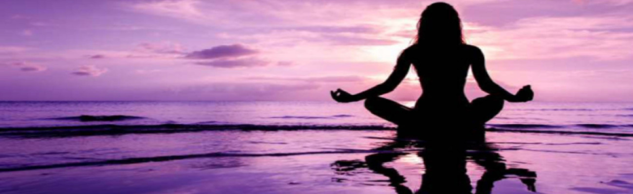 woman meditating on the water